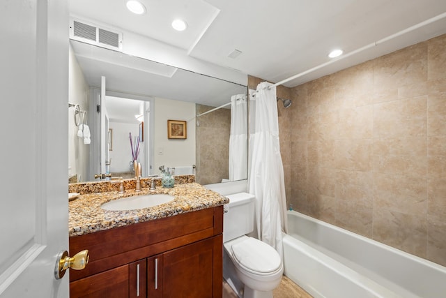 full bathroom featuring vanity, toilet, and shower / tub combo