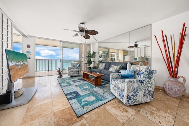 living room featuring ceiling fan and floor to ceiling windows