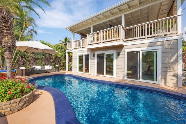 view of pool with a patio area, ceiling fan, outdoor lounge area, and a fenced in pool