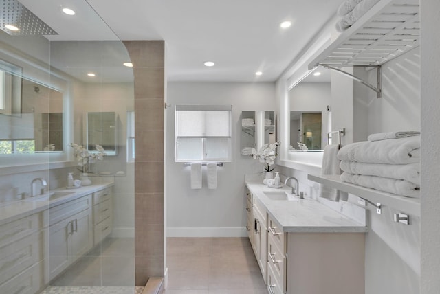 full bathroom featuring recessed lighting, baseboards, tiled shower, and vanity