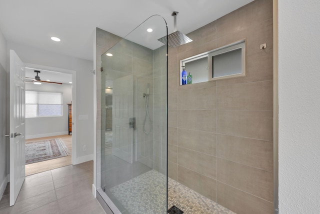 bathroom with tile patterned flooring, baseboards, walk in shower, and recessed lighting