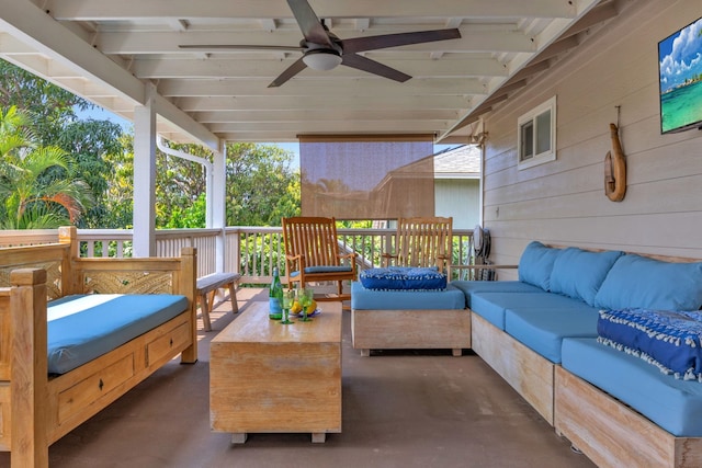 view of patio with ceiling fan and an outdoor living space