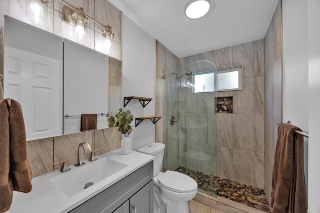 bathroom with toilet, walk in shower, backsplash, and vanity