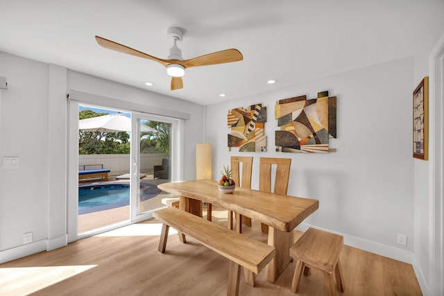 dining room featuring light wood finished floors, recessed lighting, a ceiling fan, and baseboards