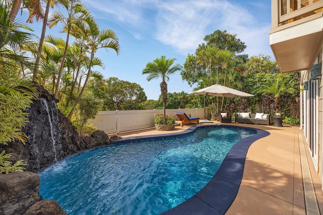 view of swimming pool with a patio, a fenced backyard, and a fenced in pool