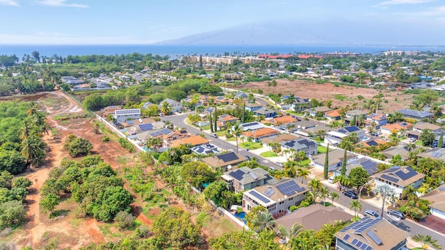 birds eye view of property with a water view and a residential view