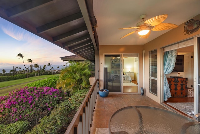 balcony at dusk with ceiling fan