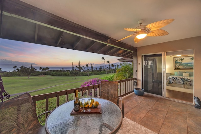 balcony at dusk with ceiling fan