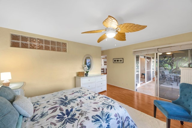 bedroom with light wood-type flooring, ceiling fan, and access to exterior