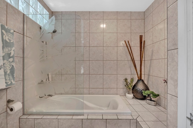 bathroom featuring a relaxing tiled tub