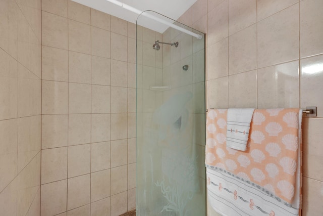 bathroom with tiled shower