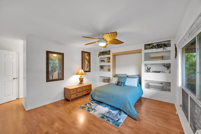 bedroom featuring ceiling fan and hardwood / wood-style floors