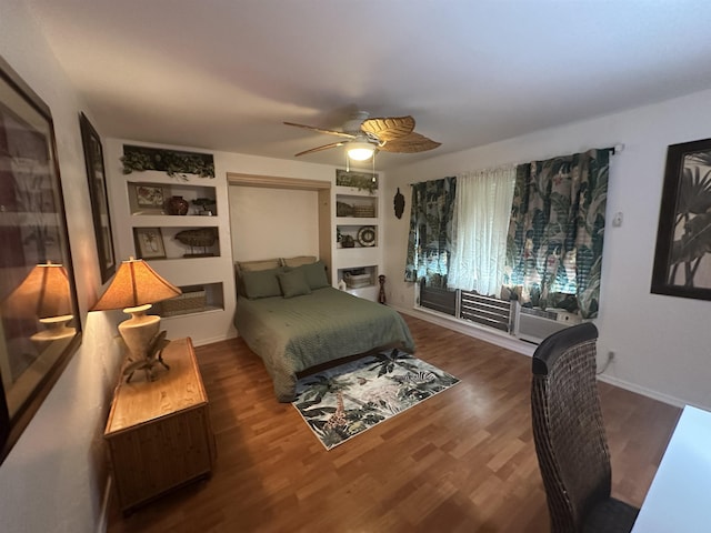 bedroom with ceiling fan and dark hardwood / wood-style flooring