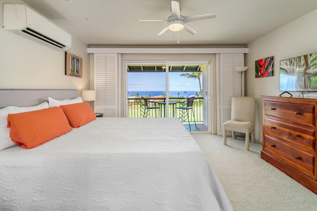 3950 Kalai Waa St Unit R 103, Kihei, HI 96753 - carpeted bedroom with a wall unit AC, access to outside, and a ceiling fan
