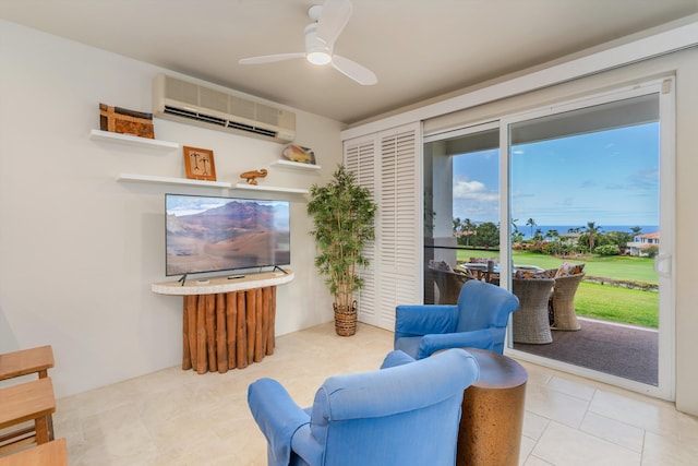 3950 Kalai Waa St Unit R 103, Kihei, HI 96753 - tiled living area with a wall mounted AC and a ceiling fan