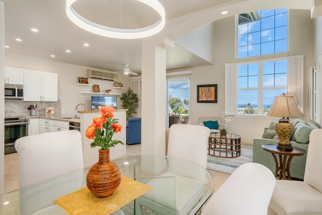 3950 Kalai Waa St Unit R 103, Kihei, HI 96753 - dining space featuring recessed lighting, a wall mounted air conditioner, and arched walkways