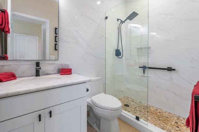 3950 Kalai Waa St Unit R 103, Kihei, HI 96753 - bathroom with a walk in shower, vanity, and tile walls
