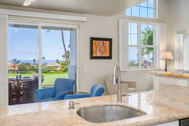 3950 Kalai Waa St Unit R 103, Kihei, HI 96753 - kitchen with light stone counters and plenty of natural light