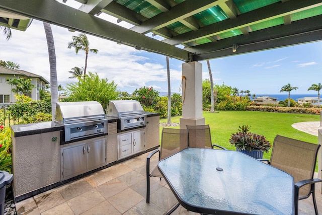 3950 Kalai Waa St Unit R 103, Kihei, HI 96753 - view of patio featuring exterior kitchen, outdoor dining area, and a pergola