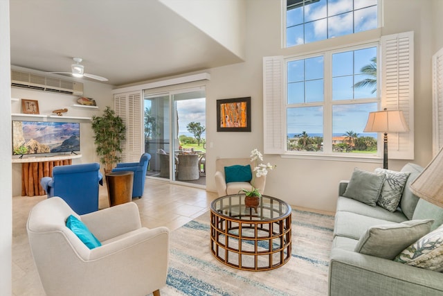 3950 Kalai Waa St Unit R 103, Kihei, HI 96753 - living area with a wall mounted AC, a ceiling fan, and tile patterned flooring