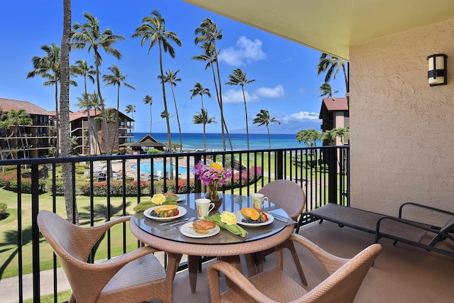 balcony featuring a water view