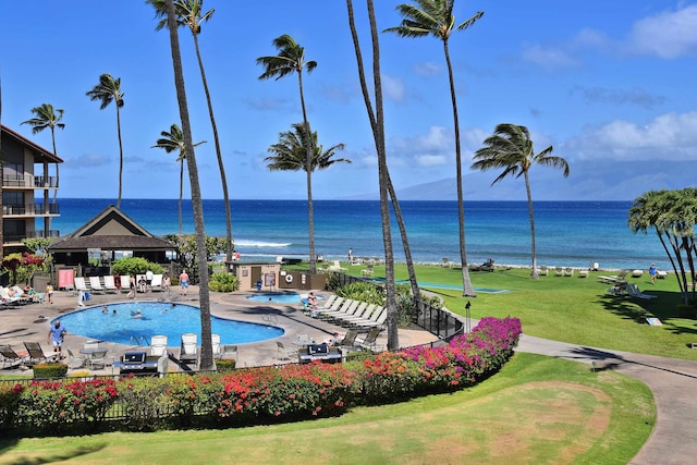 view of swimming pool featuring a water view, a gazebo, a yard, and a patio area