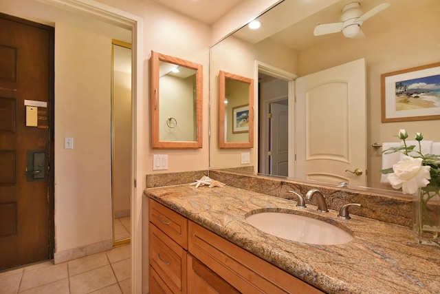 bathroom with oversized vanity, tile floors, and ceiling fan