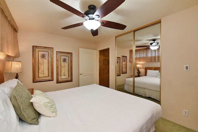 bedroom with a closet, ceiling fan, and carpet