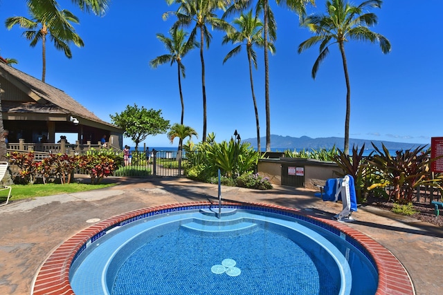 view of swimming pool with a mountain view