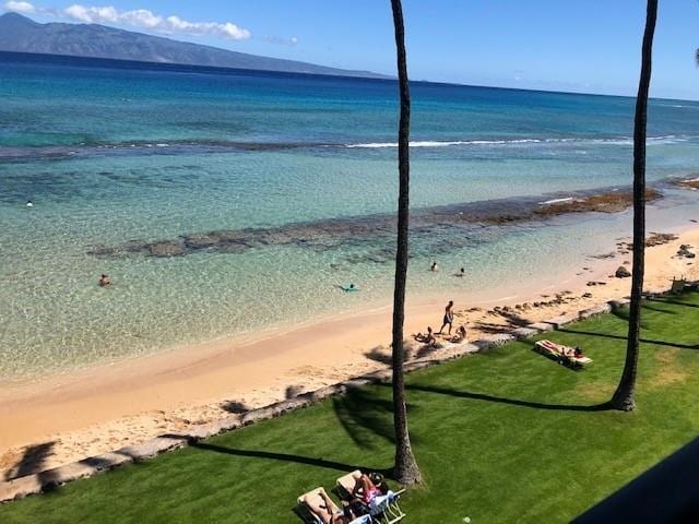 view of water feature with a beach view