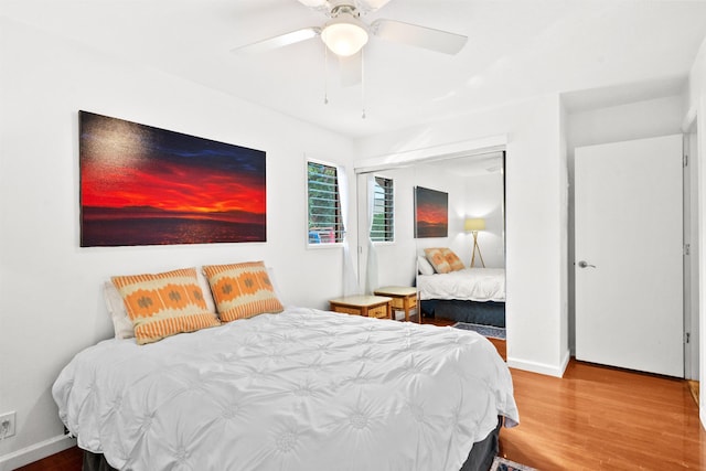 bedroom with wood-type flooring and ceiling fan