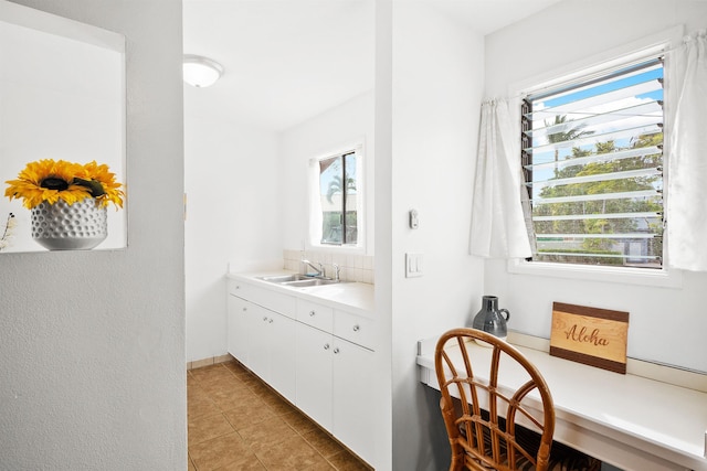 bathroom with vanity, tile patterned flooring, and a wealth of natural light