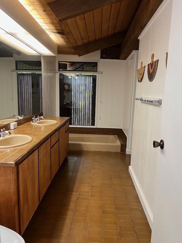 bathroom with a bath, tile patterned floors, vaulted ceiling, vanity, and wood ceiling