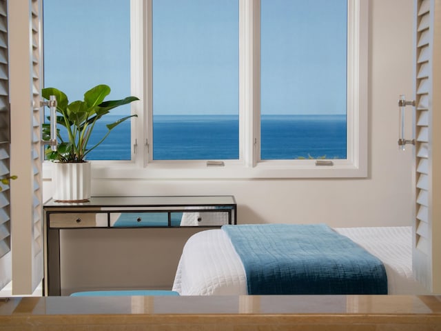 bedroom with a water view