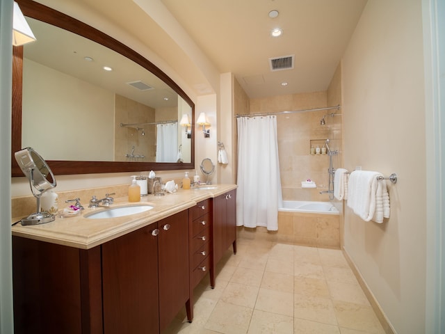 bathroom featuring vanity and shower / bath combo