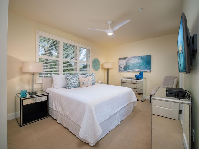 bedroom featuring ceiling fan and light colored carpet