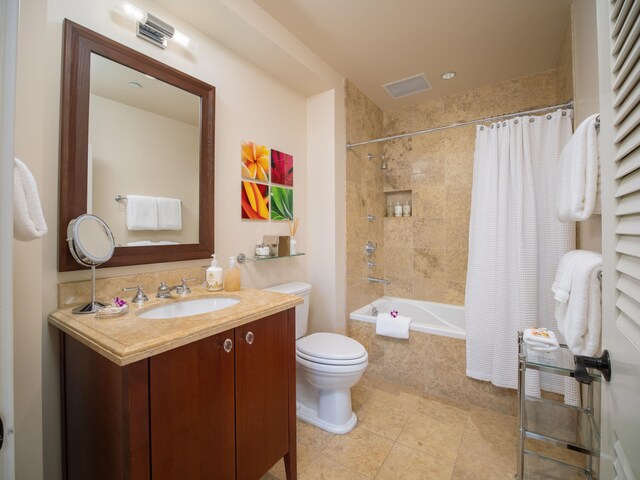 full bathroom featuring tile patterned floors, shower / bath combination with curtain, toilet, and vanity