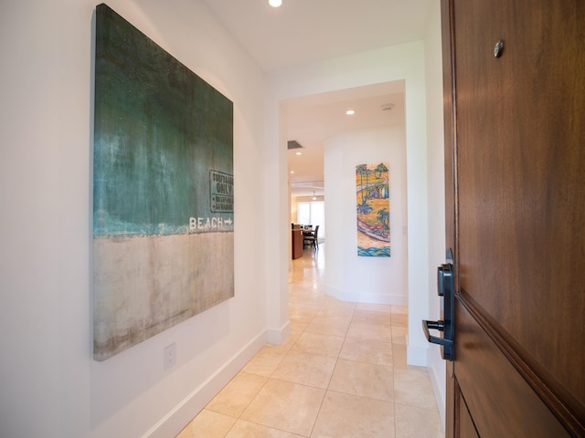 hallway featuring light tile patterned floors