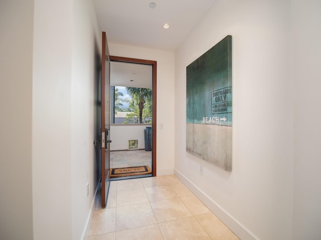 corridor with light tile patterned flooring