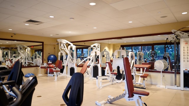 exercise room featuring a drop ceiling