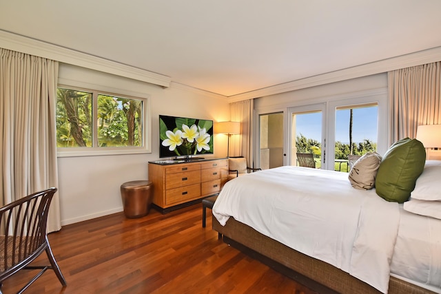 bedroom featuring access to exterior, dark hardwood / wood-style flooring, and ornamental molding