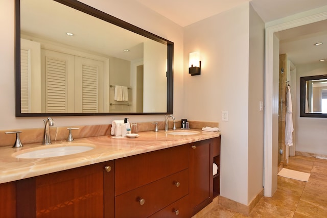 bathroom featuring tile patterned floors and vanity