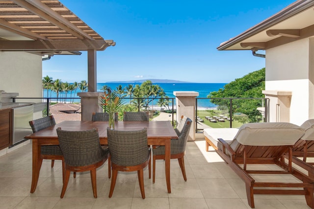 exterior space with a balcony and a water view