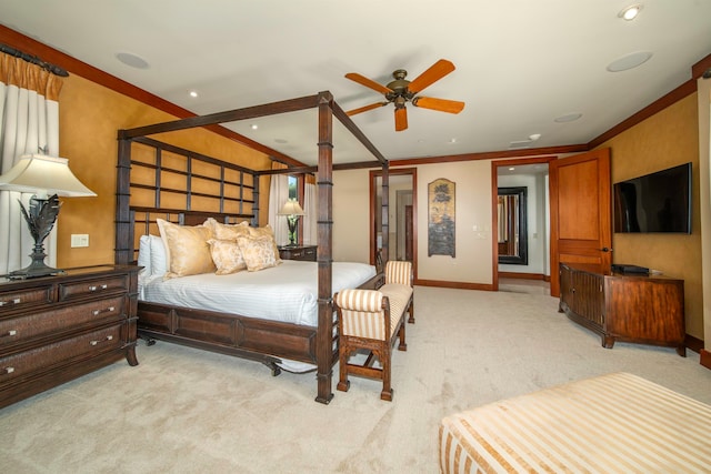 bedroom with ceiling fan, light carpet, and crown molding