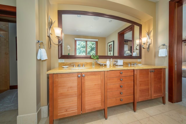 bathroom featuring tile patterned floors and vanity