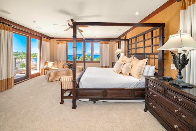 carpeted bedroom with ornamental molding, access to exterior, and ceiling fan