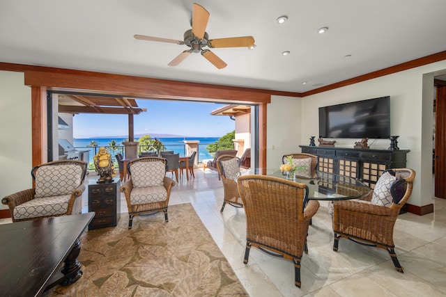 tiled living room with ornamental molding and ceiling fan