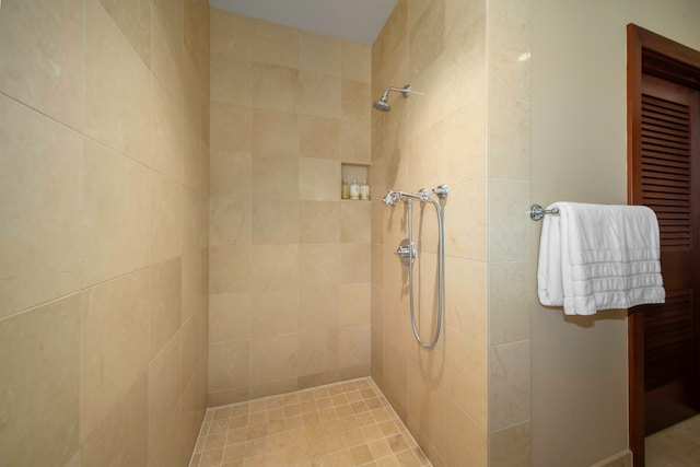 bathroom with tiled shower