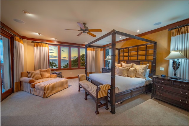 bedroom featuring ceiling fan, light colored carpet, and crown molding