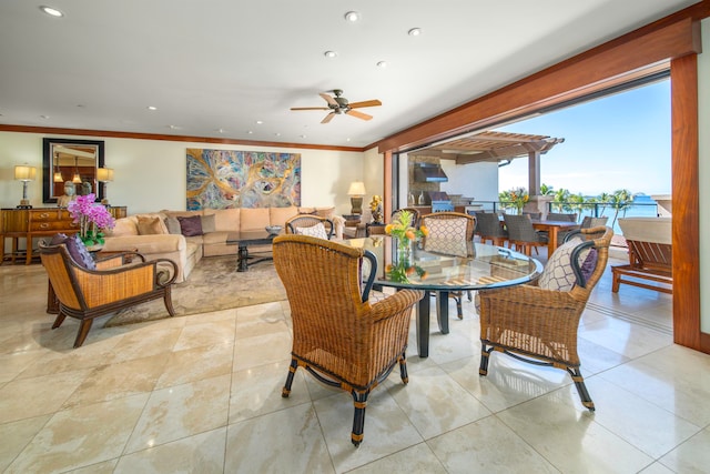 dining room featuring ornamental molding, light tile patterned floors, and ceiling fan